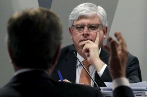 Brazil's Prosecutor-General Rodrigo Janot reacts near Senator Fernando Collor during a session of the Committee on Constitution and Justice of the Senate in Brasilia, Brazil, August 26, 2015. REUTERS/Ueslei Marcelino