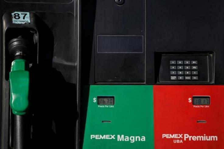 Prices are seen displayed on fuel pumps at a Pemex gas station in Mexico City